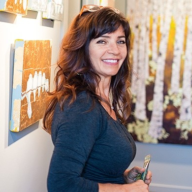 Art Consultant infront of paintings